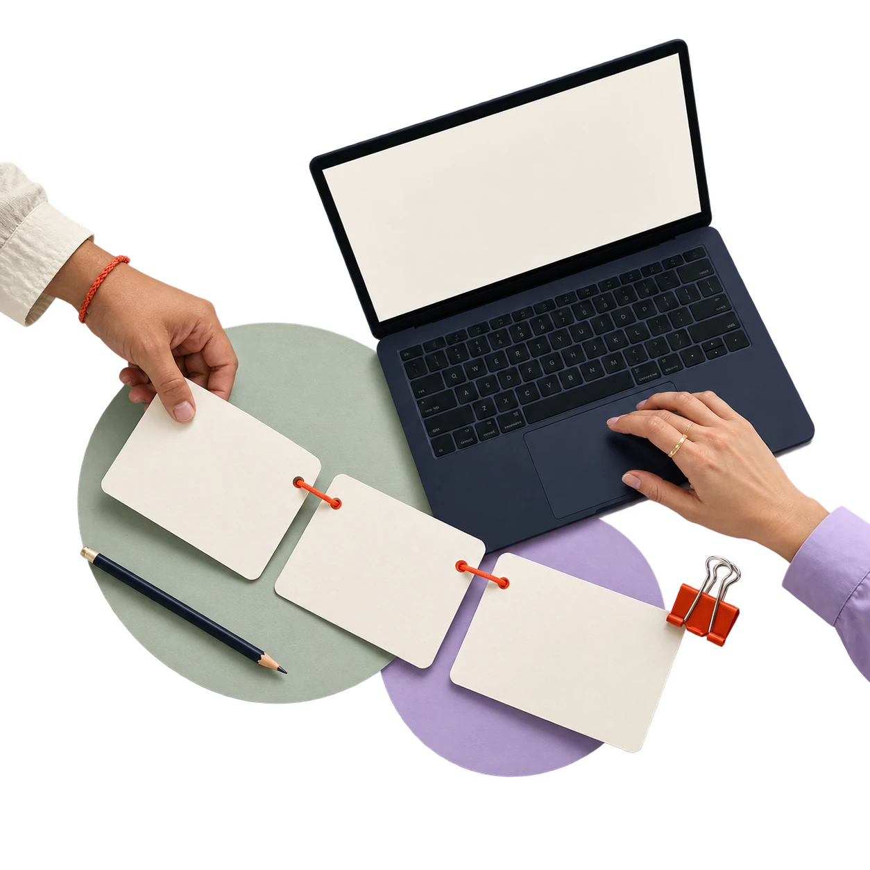 Colleagues arranging shared campaign cards beside a navy laptop.